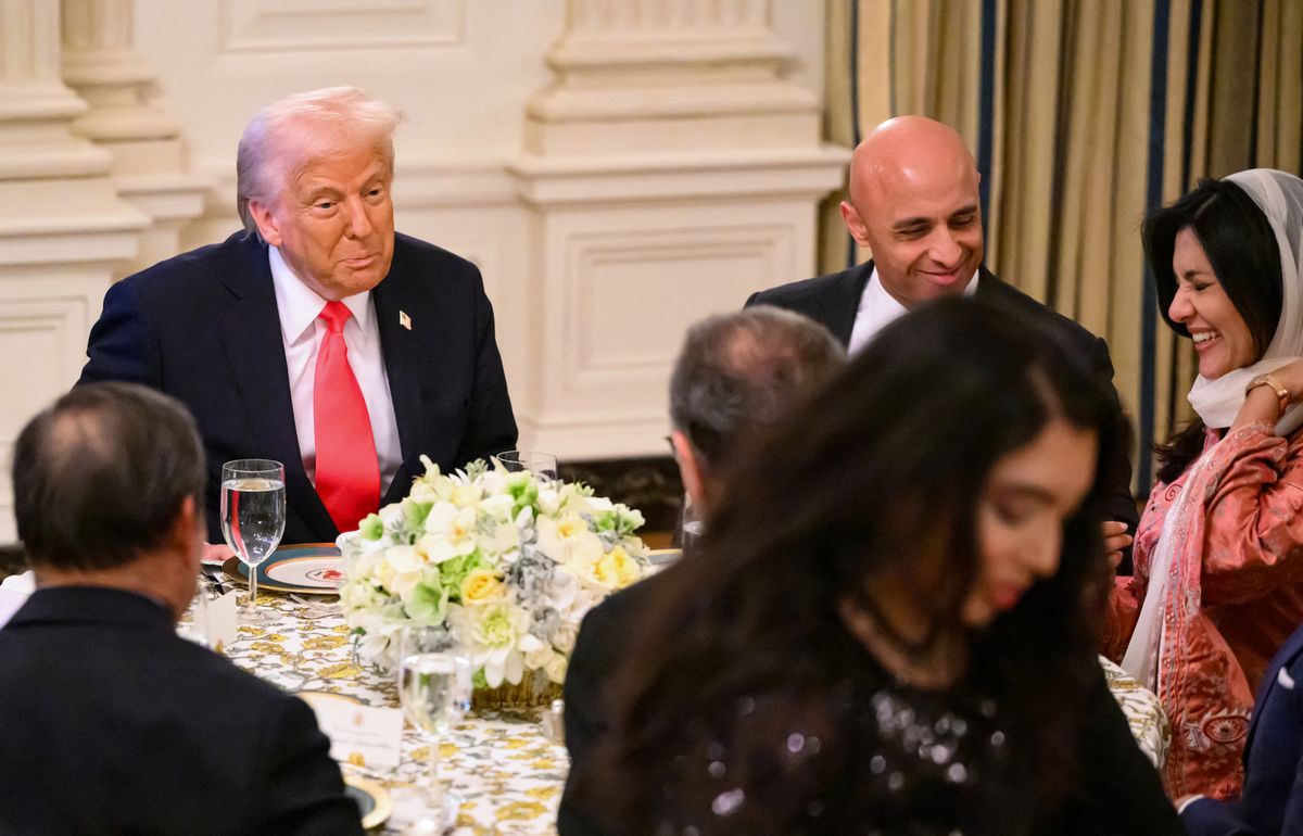 US President Donald Trump is seated with Saudi Arabia's Ambassador to the US, Princess Reema bint Bandar Al Saud, during an Iftar dinner in the State Dining Room of the White House in Washington, DC, on March 27, 2025 (Photo by Mandel NGAN / AFP)