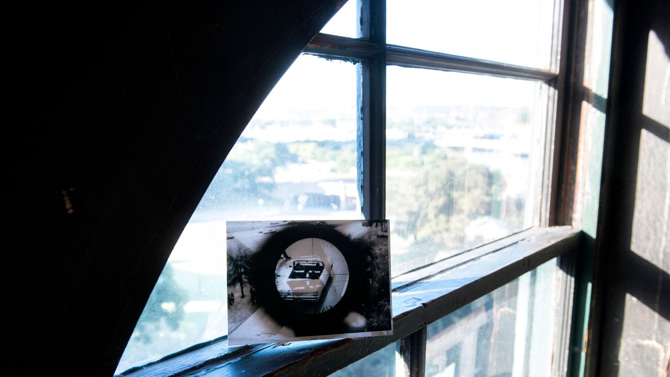 A historic federal law enforcement photo showing a Secret Service car on Elm Street in Dallas, Texas during post JFK assassination investigations is seen from its approximate angle on the 6th floor at the Texas School Book Depository building in Dallas, T