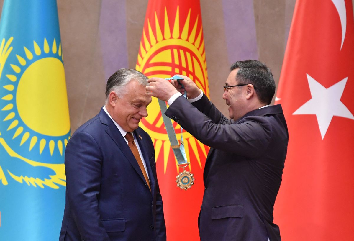 Kyrgyzstan's President Sadyr Japarov awards Hungary's Prime Minister Viktor Orban with the Supreme Order of the Turkic Peace during the 11th summit of the of heads of state of the Organization of Turkic States (OTS) at the Yntymak Ordo state residence in Bishkek on November 6, 2024. (Photo by VYACHESLAV OSELEDKO / AFP)