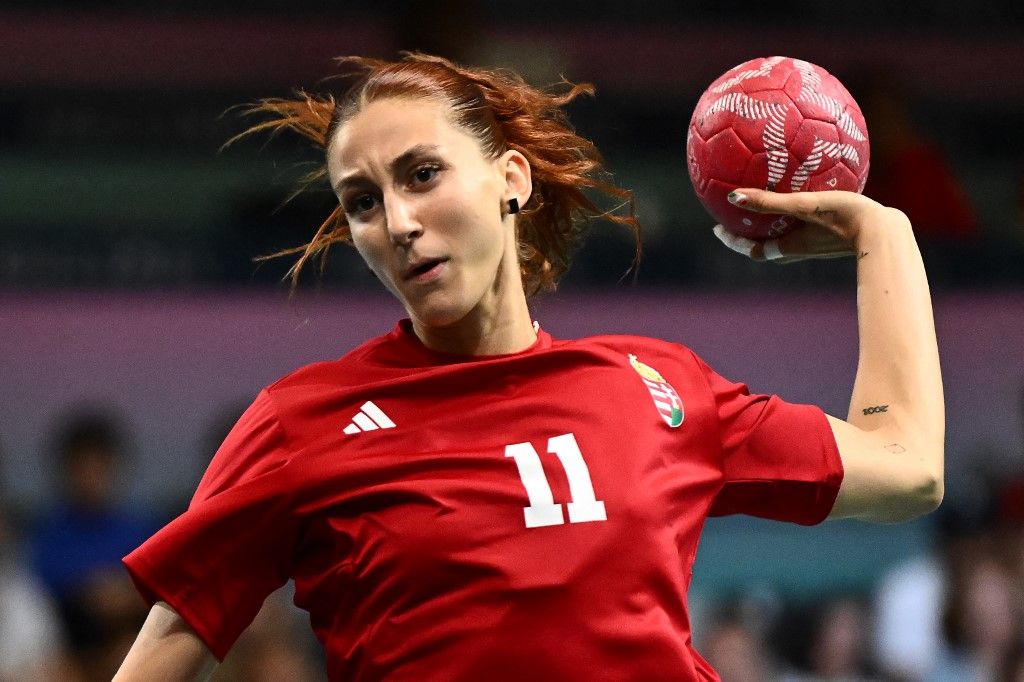 Hungary's right back #11 Anna Albek shoots during the Women's Preliminary Round Group B handball match between Hungary and Netherlands of the Paris 2024 Olympic Games, at the Paris South Arena in Paris, on August 3, 2024. (Photo by Aris MESSINIS / AFP)
