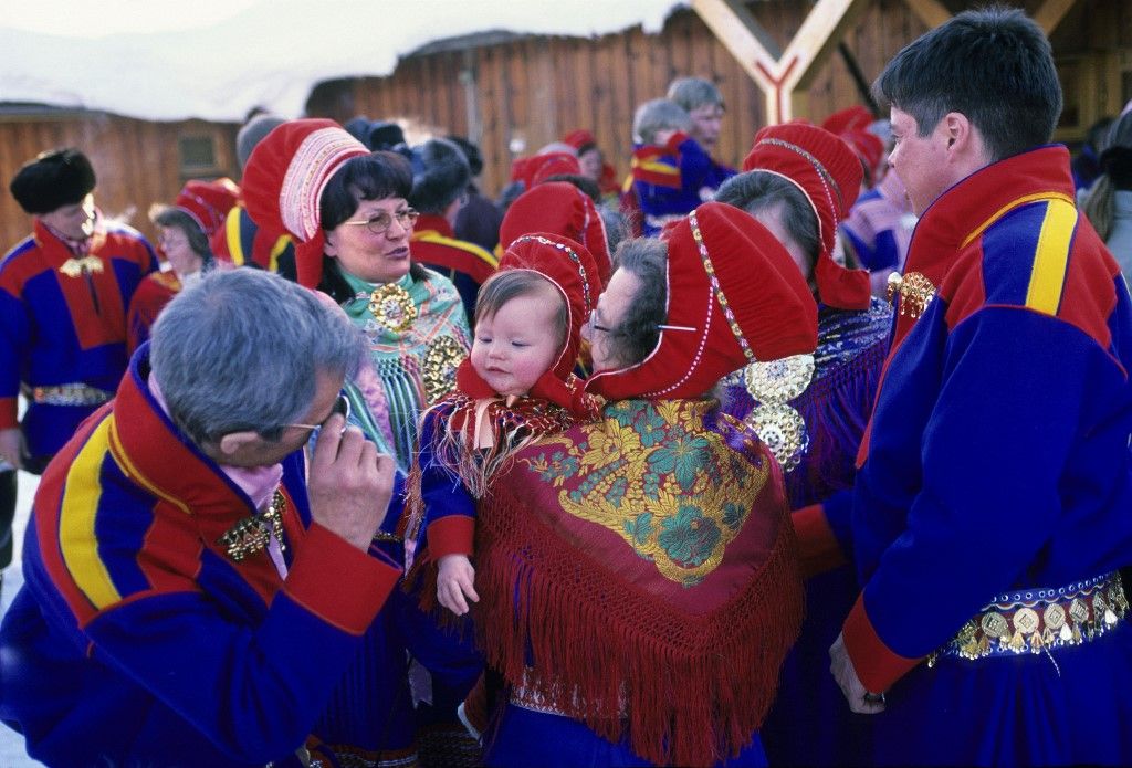 Norway, Finnmark County, Karasjok, Just baptised child and parents (Photo by BOISVIEUX Christophe / hemis.fr / Hemis via AFP)