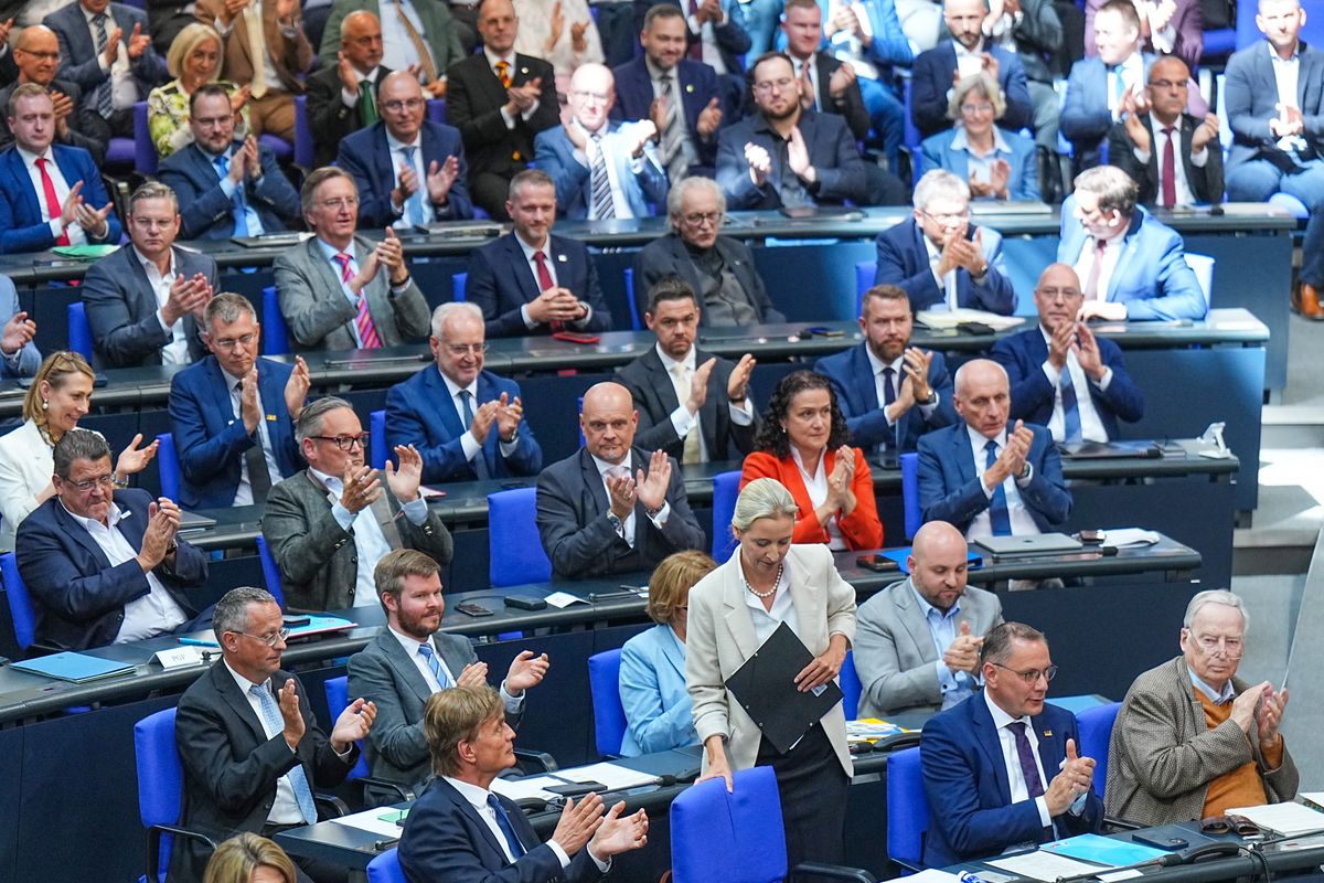 14 May 2025, Berlin: The AFD parliamentary group applauds Alice Weidel (standing), federal leader and parliamentary group leader of the AfD, after her speech following the Federal Chancellor's government statement in the plenary session of the Bundestag. Photo: Michael Kappeler/dpa (Photo by MICHAEL KAPPELER / DPA / dpa Picture-Alliance via AFP)