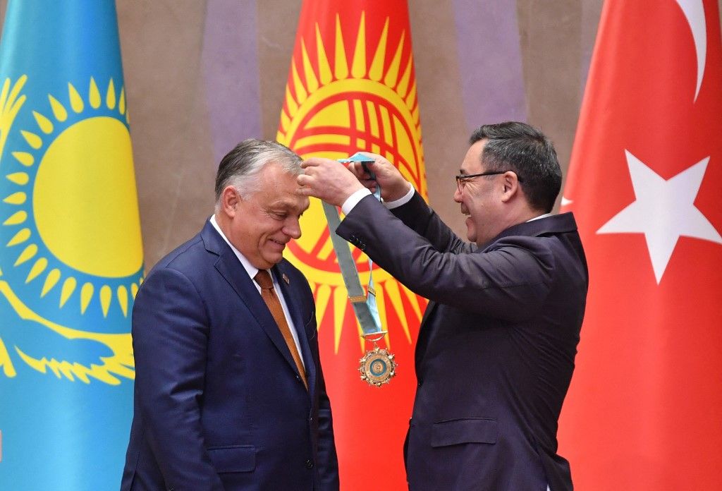 Kyrgyzstan's President Sadyr Japarov awards Hungary's Prime Minister Viktor Orban with the Supreme Order of the Turkic Peace during the 11th summit of the of heads of state of the Organization of Turkic States (OTS) at the Yntymak Ordo state residence in Bishkek on November 6, 2024. (Photo by VYACHESLAV OSELEDKO / AFP)