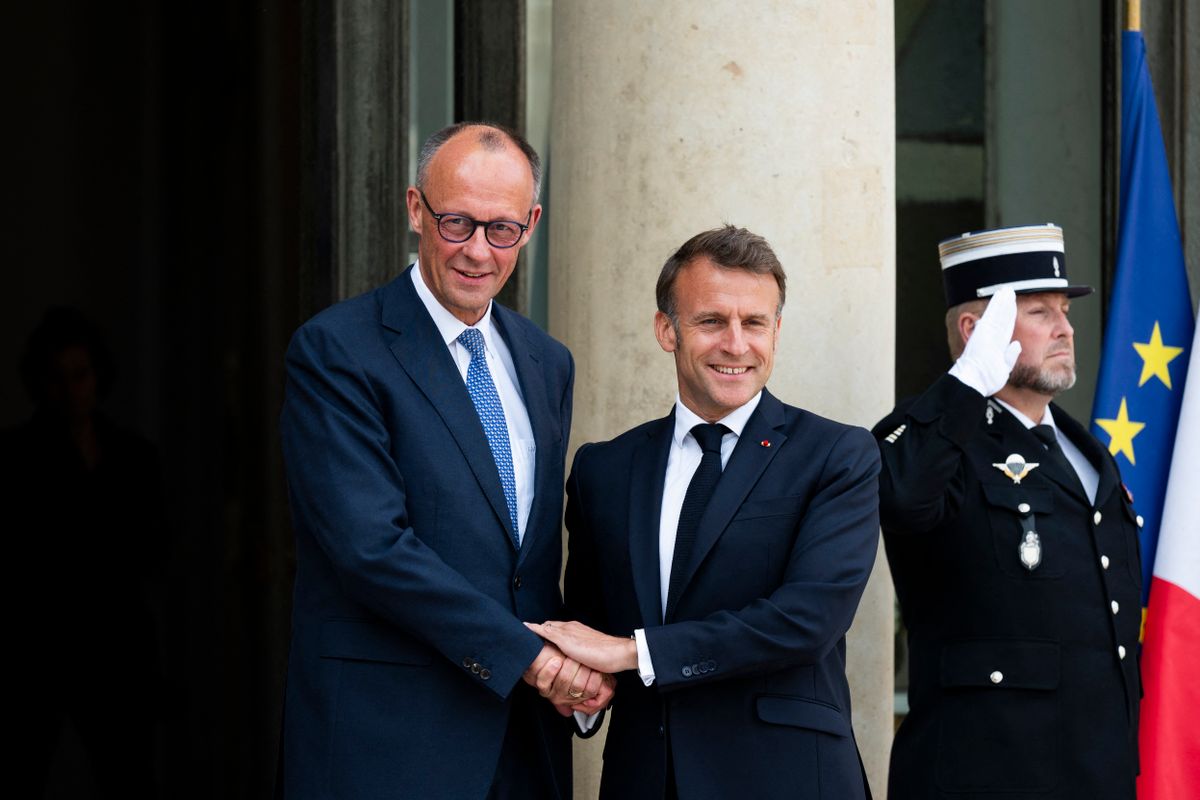 France s President Emmanuel Macron welcomes Germany s newly elected Chancellor Friedrich Merz at the Elysee presidential palace in Paris on May 7, 2025. (Photo by Magali Cohen / Hans Lucas / Hans Lucas via AFP)