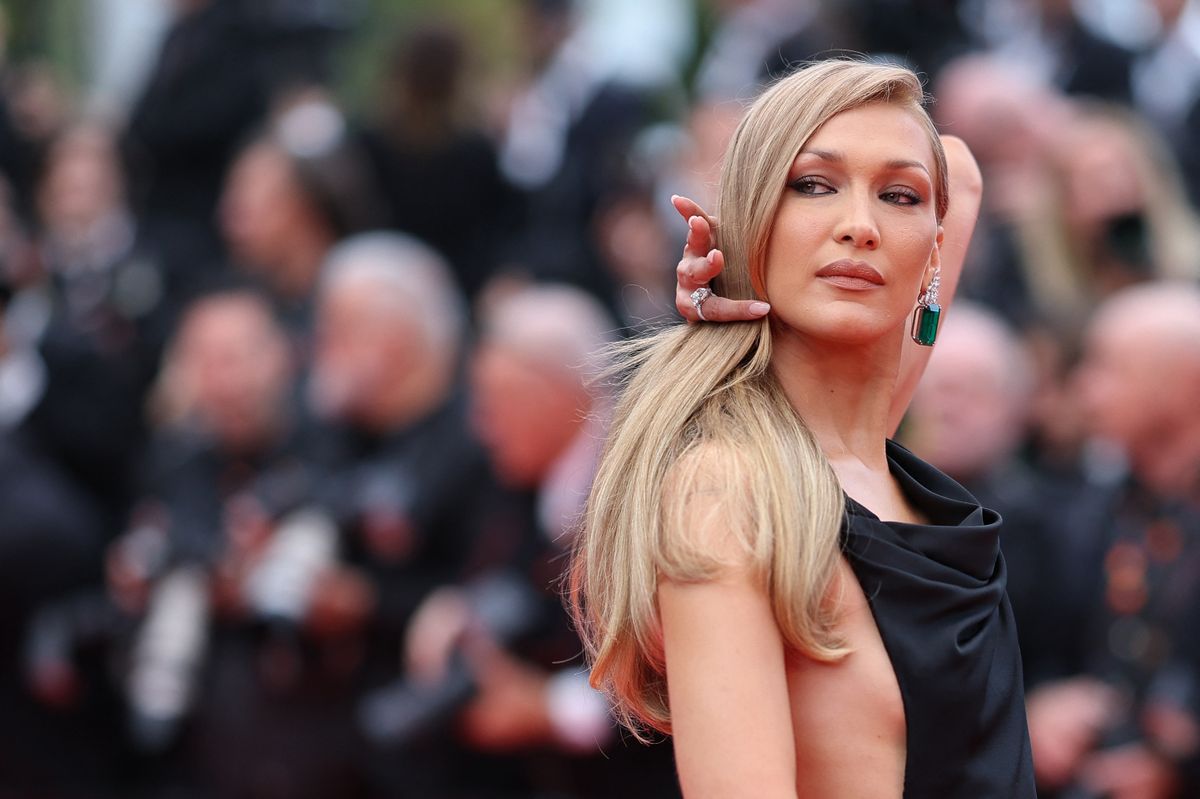 US model Bella Hadid arrives for the Opening Ceremony and the screening of the film "Partir un Jour" (Bye Bye) presented out of competition at the 78th edition of the Cannes Film Festival in Cannes, southern France, on May 13, 2025. (Photo by Sameer AL-DOUMY / AFP)