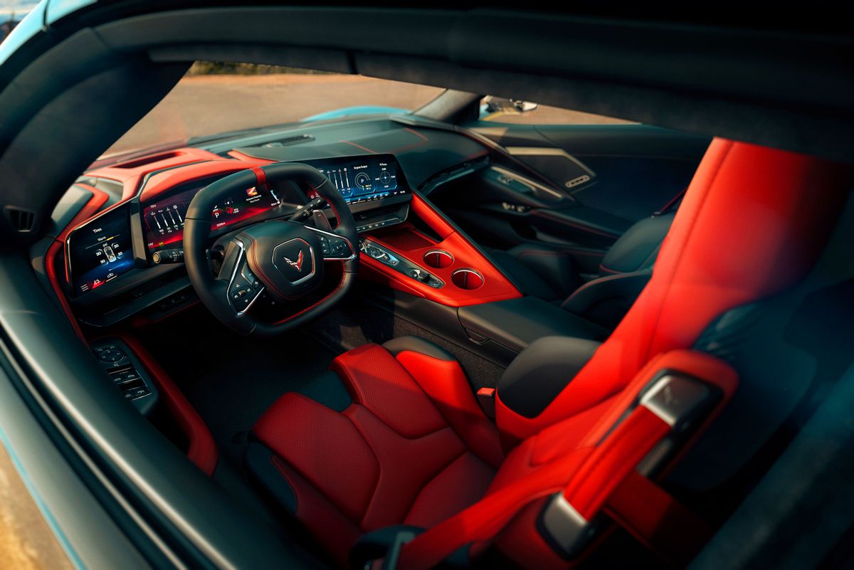 Asymmetrical Adrenaline Red interior on 2026 Chevrolet Corvette Stingray. Preproduction model shown, actual production model may vary.