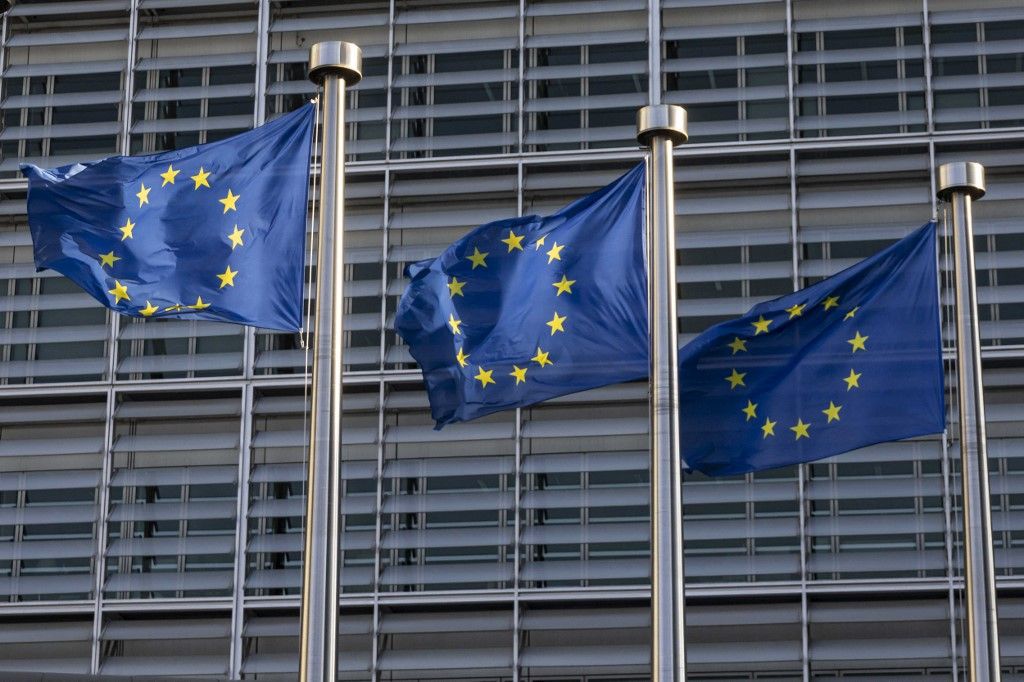 Flags of Europe as seen waving from the flagpoles. The European Flag is the symbol of Council of Europe COE and the European Union EU as seen in the Belgian capital in front of the Le Berlaymont building, European Commission headquarters next to Europa building HQ of the European Council at the European Quarter in Brussels, where the headquarters of the pan-European institutions and organizations are located. Brussels, Belgium on April 2024 (Photo by Nicolas Economou/NurPhoto) (Photo by Nicolas Economou / NurPhoto / NurPhoto via AFP)