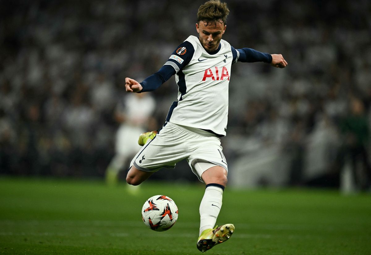 Tottenham Hotspur's English midfielder #10 James Maddison shoots to score his team second goal during the UEFA Europa League Semi-Final First Leg football match between Tottenham Hotspur and Bodoe/Glimt at the Tottenham Hotspur Stadium in London, on May 1, 2025. (Photo by Ben STANSALL / AFP)
