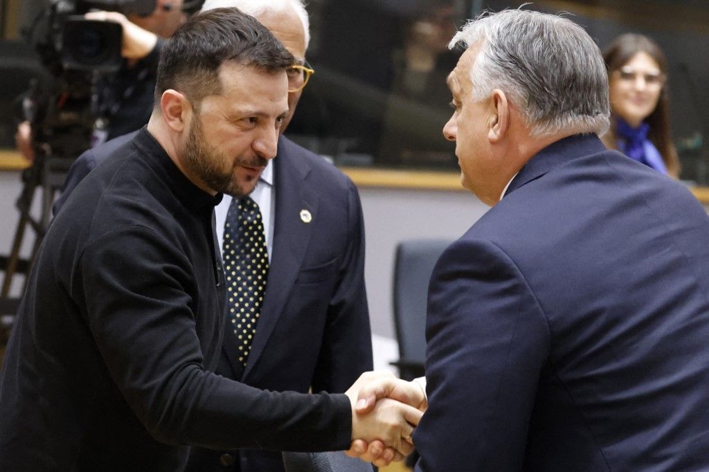 Hungary's Prime Minister Viktor Orban (R) shakes hands with Ukraine's President Volodymyr Zelensky prior to the Special European Council roundtable meeting to discuss continued support for Ukraine and European defence at the EU headquarters in Brussels on March 6, 2025. European Union leaders hold emergency talks in Brussels gathering as the Trump administration upends traditional alliances and retracts wartime backing of Ukraine. The summit brings all 27 EU leaders together for the first time since the explosive meeting between US and Ukraine presidents on February 28, 2025, with US military aid and intelligence sharing since suspended. (Photo by Ludovic MARIN / AFP)