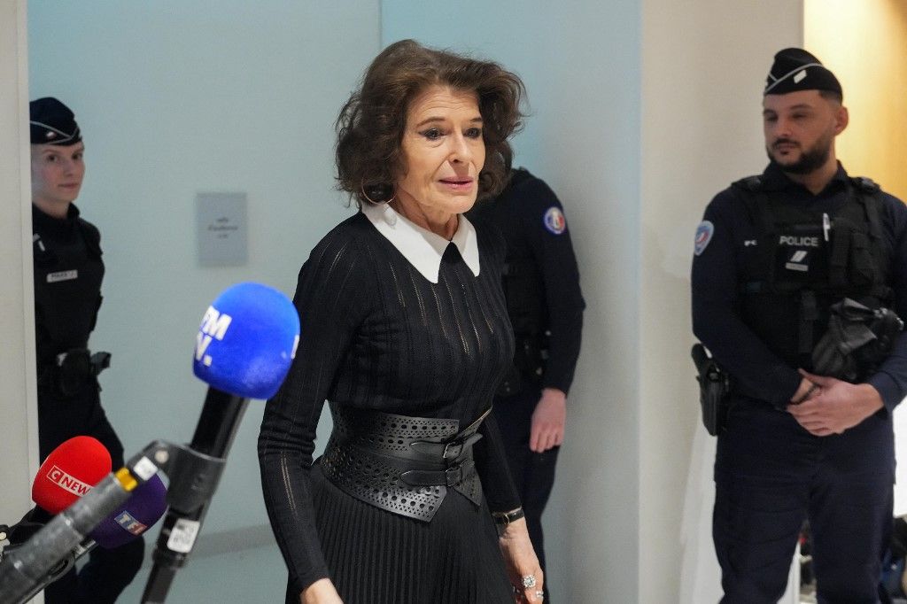 French actress Fanny Ardant (C) enters the courtroom to attend the trial of French actor Gerard Depardieu in which he is charged with sexually assaulting two women during a film shoot in 2021, at the Paris criminal court in the Tribunal de Paris courthouse, on March 26, 2025. Depardieu, 76, who has made more than 200 films and television series, has been accused of improper behaviour by around 20 women but this is the first case to come to trial. The two plaintiffs -- Amelie, 54, a set dresser, and Sarah (name changed), 34, an assistant director -- allege sexual assault during the filming in 2021 of "Les Volets Verts" ("The Green Shutters") by director Jean Becker. (Photo by Dimitar DILKOFF / AFP)