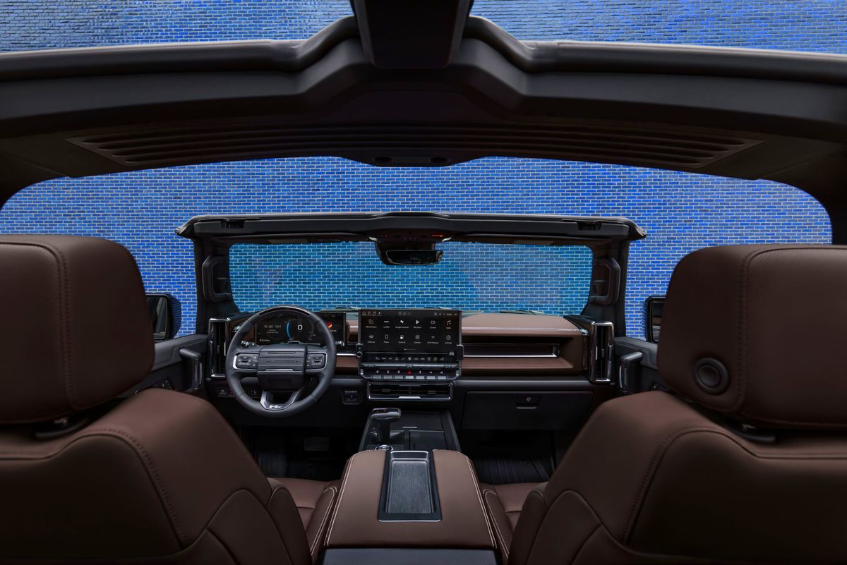 Front-facing view of the interior of the 2026 GMC HUMMER EV SUV with the Infinity Roof Panels removed. Stealth Eclipse Interior color shown.