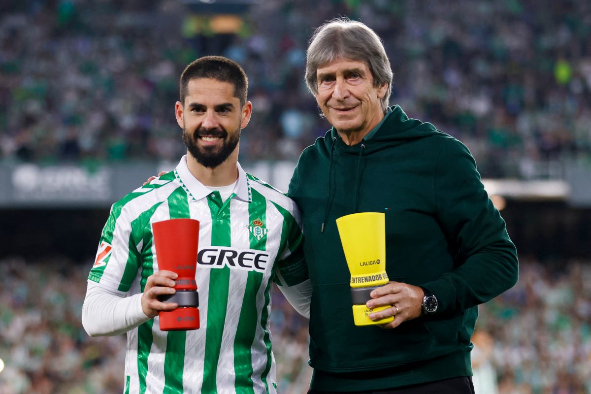Francisco Roman Alarcon ''Isco'' of Real Betis and Manuel Pellegrini, head coach of Real Betis, participate in the La Liga EA Sport match between Real Betis and Sevilla FC at Benito Villamarin in Seville, Spain, on March 30, 2025. (Photo by Jose Luis Contreras/Dax Images) (Photo by DAX Images/NurPhoto) (Photo by DAX Images / NurPhoto / NurPhoto via AFP)