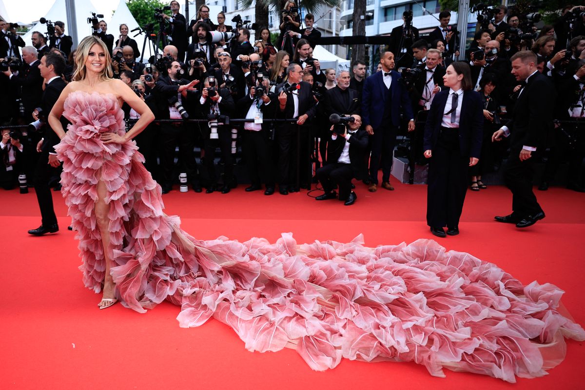 German model Heidi Klum arrives for the Opening Ceremony and the screening of the film "Partir un Jour" (Bye Bye) presented out of competition at the 78th edition of the Cannes Film Festival in Cannes, southern France, on May 13, 2025. (Photo by Valery HACHE / AFP)