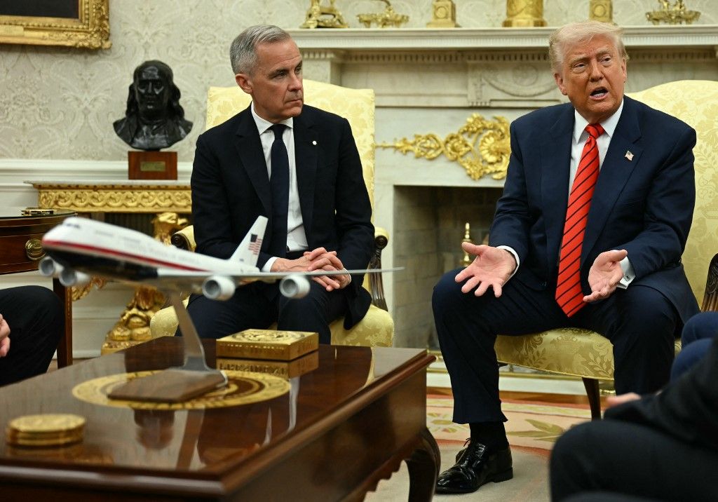 US President Donald Trump meets with Canadian Prime Minister Mark Carney in the Oval Office of the White House in Washington, DC, on May 6, 2025. (Photo by Jim WATSON / AFP)