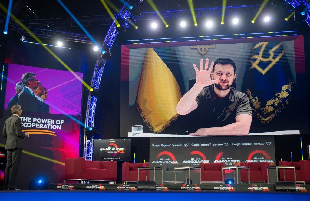 Ukrainian President Volodymyr Zelensky (on display) speaks via video conference with Austria's Federal President Alexander Van der Bellen and Austria's Federal Chancellor Karl Nehammer at the 4GAMECHANGERS digital festival in Vienna on June 30, 2022. (Photo by GEORG HOCHMUTH / APA / AFP) / Austria OUT