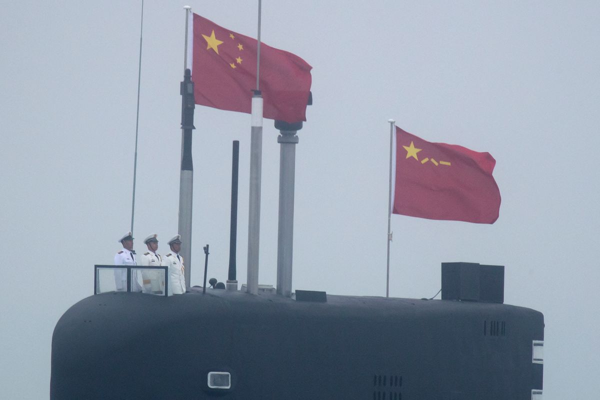 A new type 094A Jin-class nuclear submarine Long March 10 of the Chinese People's Liberation Army (PLA) Navy participates in a naval parade to commemorate the 70th anniversary of the founding of China's PLA Navy in the sea near Qingdao, in eastern China's Shandong province on April 23, 2019. China celebrated the 70th anniversary of its navy by showing off its growing fleet in a sea parade featuring a brand new guided-missile destroyer. (Photo by Mark Schiefelbein / POOL / AFP)