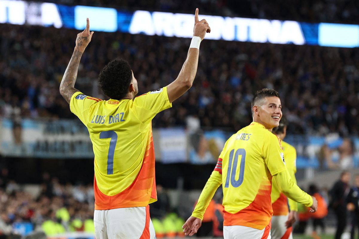 Lionel Messi Colombia's forward #07 Luis Diaz celebrates after scoring a goal with midfielder #10 James Rodriguez during the 2026 FIFA World Cup South American qualifiers football match between Argentina and Colombia at the Mas Monumental stadium in Buenos Aires, on June 10, 2025. (Photo by Alejandro PAGNI / AFP)