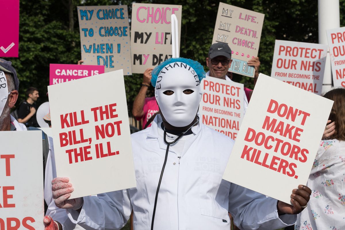 LONDON, UNITED KINGDOM - JUNE 20, 2025: Anti-euthanasia campaigners gather outside Houses of Parliament to demonstrate their opposition to assisted dying as Terminally Ill Adults (End of Life) Bill reaches Third Reading debate and a critical vote on the Bill as a whole in the House of Commons in London, United Kingdom on June 20, 2025. (Photo by WIktor Szymanowicz/NurPhoto) (Photo by WIktor Szymanowicz / NurPhoto via AFP)