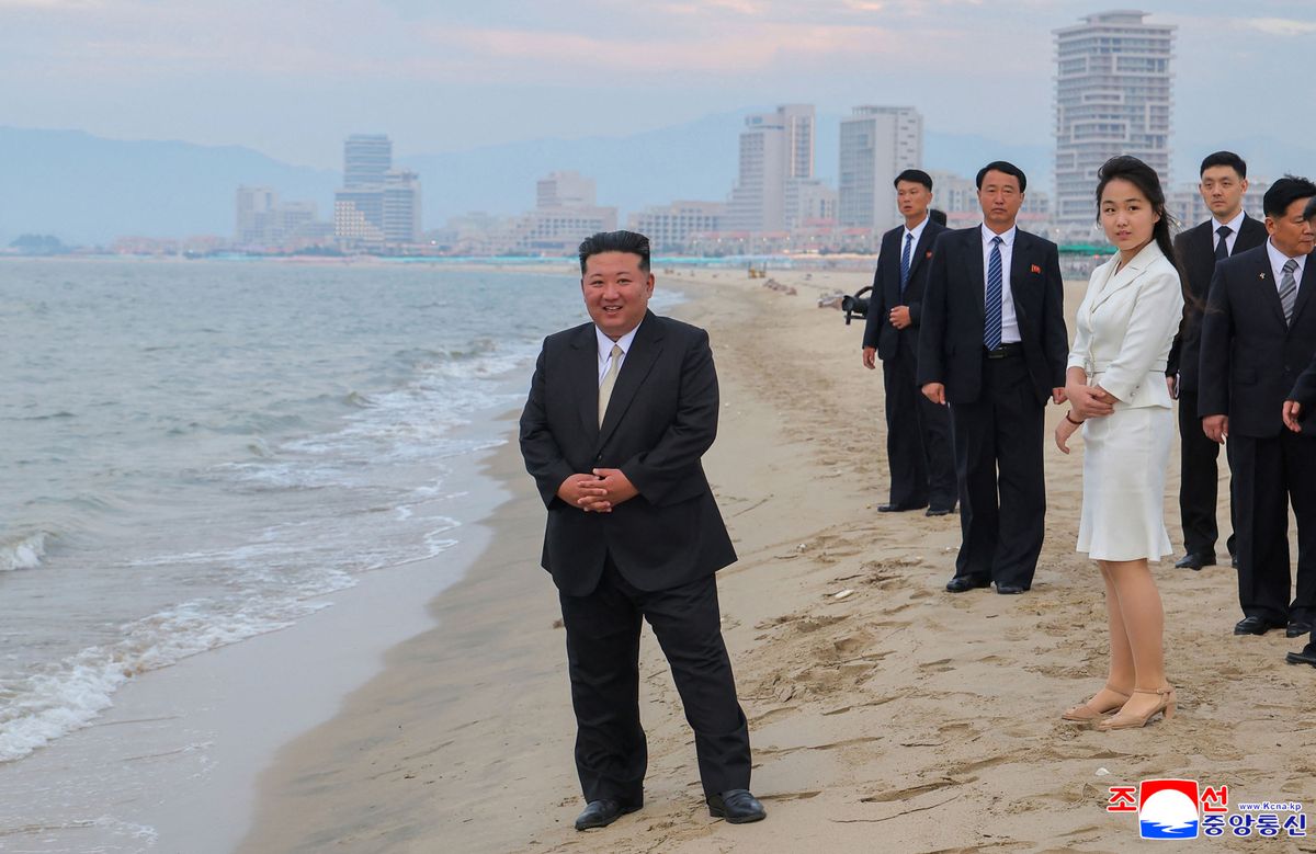 This picture taken on June 24, 2025 and released by North Korea's official Korean Central News Agency (KCNA) on June 26, 2025 shows North Korean leader Kim Jong Un (L) and his daughter Kim Ju Ae (front R) visiting the Wonsan Kalma coastal tourist area in Kangwon Province, North Korea. (Photo by KCNA VIA KNS / AFP) / South Korea OUT / ---EDITORS NOTE--- RESTRICTED TO EDITORIAL USE - MANDATORY CREDIT "AFP PHOTO/KCNA VIA KNS" - NO MARKETING NO ADVERTISING CAMPAIGNS - DISTRIBUTED AS A SERVICE TO CLIENTS
THIS PICTURE WAS MADE AVAILABLE BY A THIRD PARTY. AFP CAN NOT INDEPENDENTLY VERIFY THE AUTHENTICITY, LOCATION, DATE AND CONTENT OF THIS IMAGE. / 