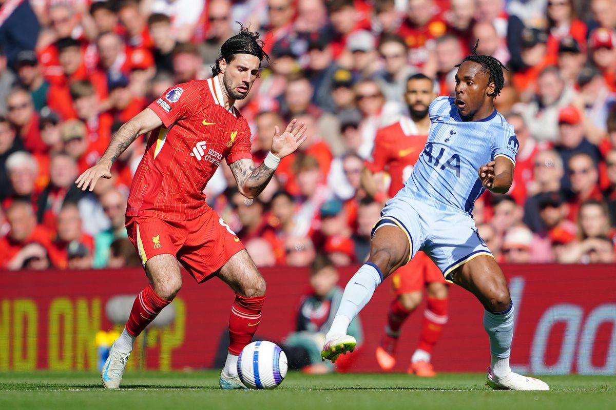 Liverpool's Dominik Szoboszlai (left) and Tottenham Hotspur's Destiny Udogie battle for the ball during the Premier League match at Anfield, Liverpool. Picture date: Sunday April 27, 2025.