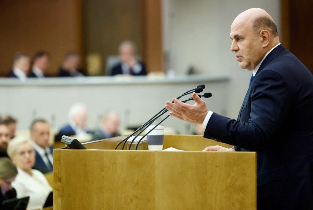 In this pool photograph distributed by the Russian state agency Sputnik, Russia's Prime Minister Mikhail Mishustin presents the government's annual report at a session of the State Duma, the country's lower house of parliament, in Moscow on March 26, 2025. (Photo by Dmitry ASTAKHOV / POOL / AFP)