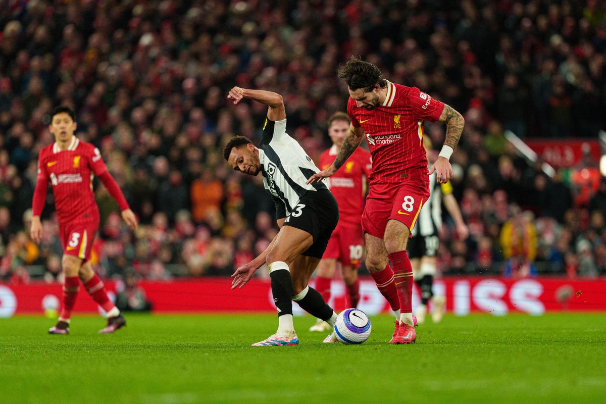 Newcastle United's Jacob Murphy battles for possession with Liverpool's Dominik Szoboszlai during the Premier League match between Liverpool and Newcastle United at Anfield in Liverpool, England, on February 26, 2025. (Photo by MI News/NurPhoto) (Photo by MI News / NurPhoto / NurPhoto via AFP)