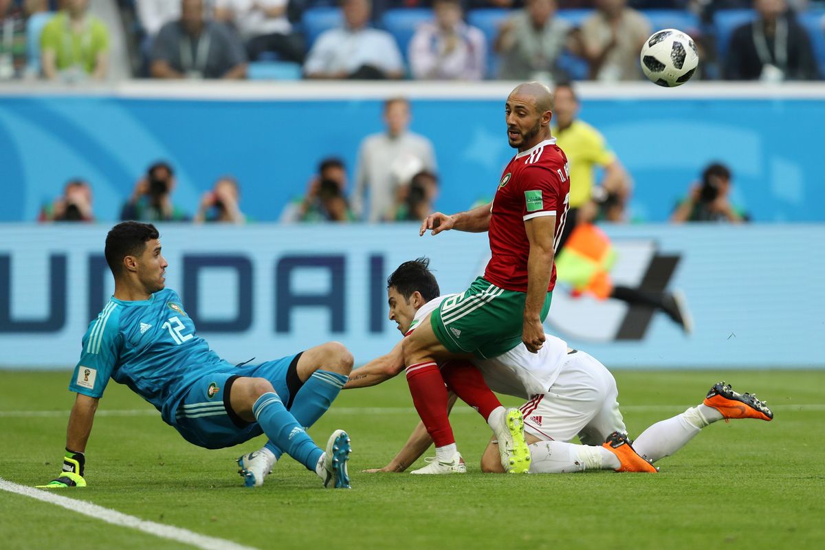 SAINT PETERSBURG, RUSSIA - JUNE 15:  Monir El Kajoui of Morocco clears the ball during the 2018 FIFA World Cup Russia group B match between Morocco and Iran at Saint Petersburg Stadium on June 15, 2018 in Saint Petersburg, Russia.  (Photo by Patrick Smith - FIFA/FIFA via Getty Images)
