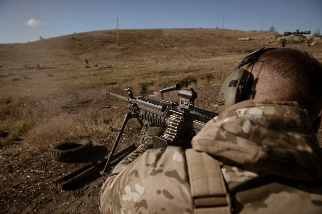 DONETSK REGION, UKRAINE - OCTOBER 26: Mykola, a soldier shoots with a US-made light machine gun, M249 SAW known as Minimi as a drone unit from a battalion of the 24th Brigade of the Ukrainian Armed Forces receives training on shooting with various weapons, medical evacuations, and tactical medicine deployment in Donetsk region, Ukraine on October 26, 2024. Andre Luis Alves / Anadolu (Photo by Andre Luis Alves / Anadolu via AFP)