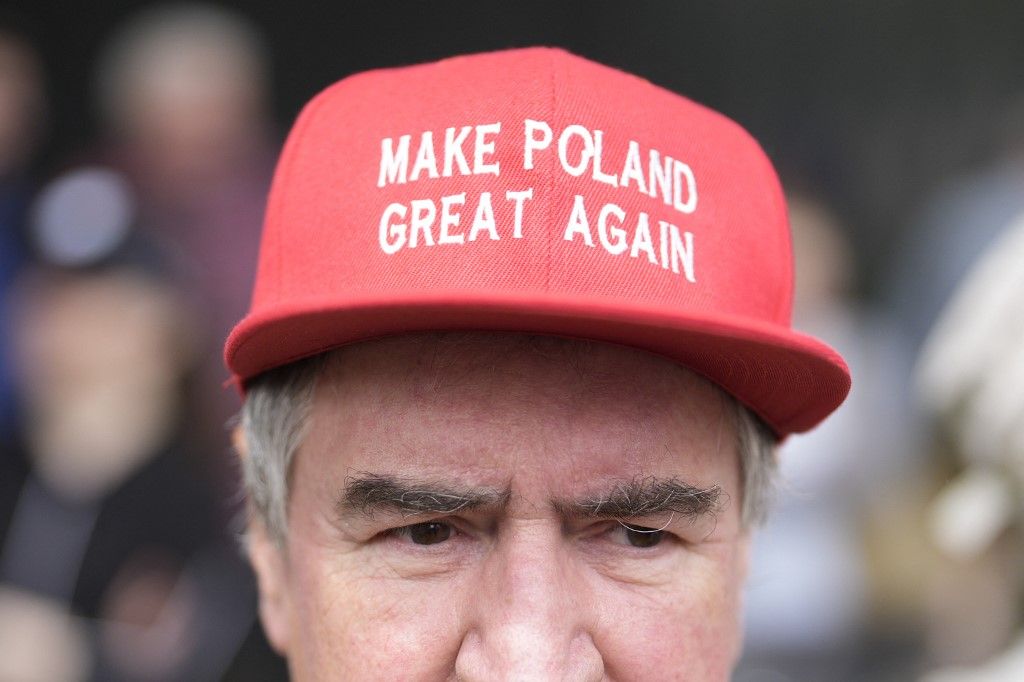 A man with a Polish MAGA hat is seen during an anti-EU rally at the German embassy in Warsaw, Poland on 03 June, 2025. Protesters, led by nationalist activist Robert Bakiewicz rallied against migration policies claiming Germany has too much power in European politics which they see as a threat to Polish sovereignty. (Photo by Jaap Arriens/NurPhoto) (Photo by Jaap Arriens / NurPhoto via AFP)