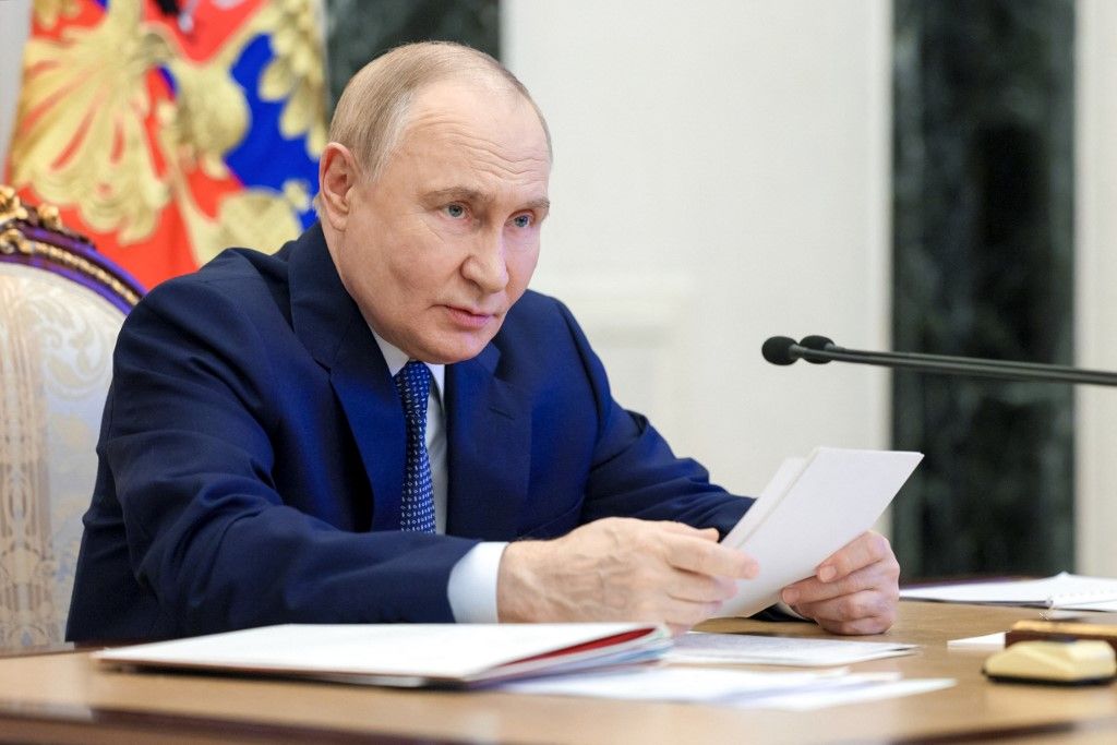 In this pool photograph distributed by the Russian state agency Sputnik, Russia's President Vladimir Putin chairs a meeting on the state armament program for 2027-2036 at the Kremlin in Moscow on June 11, 2025. (Photo by Gavriil Grigorov / POOL / AFP)