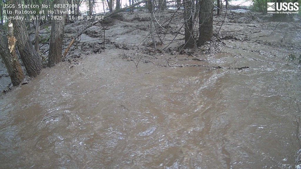 This United States Geological Survey (USGS) handout photo released by the Albuquerque National Weather Service via X (formerly Twitter) shows the flooded banks of the Ruidoso River near Ruidoso, New Mexico on July 8, 2025. More than 160 people remain unaccounted for after devastating floods in Texas while the US National Weather Service on July 8 declared a flash flood emergency in Ruidoso, a small town 184 miles (296 kilometers) south of Albuquerque, in the neighboring state of New Mexico. (Photo by UNITED STATES GEOLOGICAL SURVEY / AFP) / RESTRICTED TO EDITORIAL USE - MANDATORY CREDIT "AFP PHOTO / United States Geological Survey " - NO MARKETING NO ADVERTISING CAMPAIGNS - DISTRIBUTED AS A SERVICE TO CLIENTS