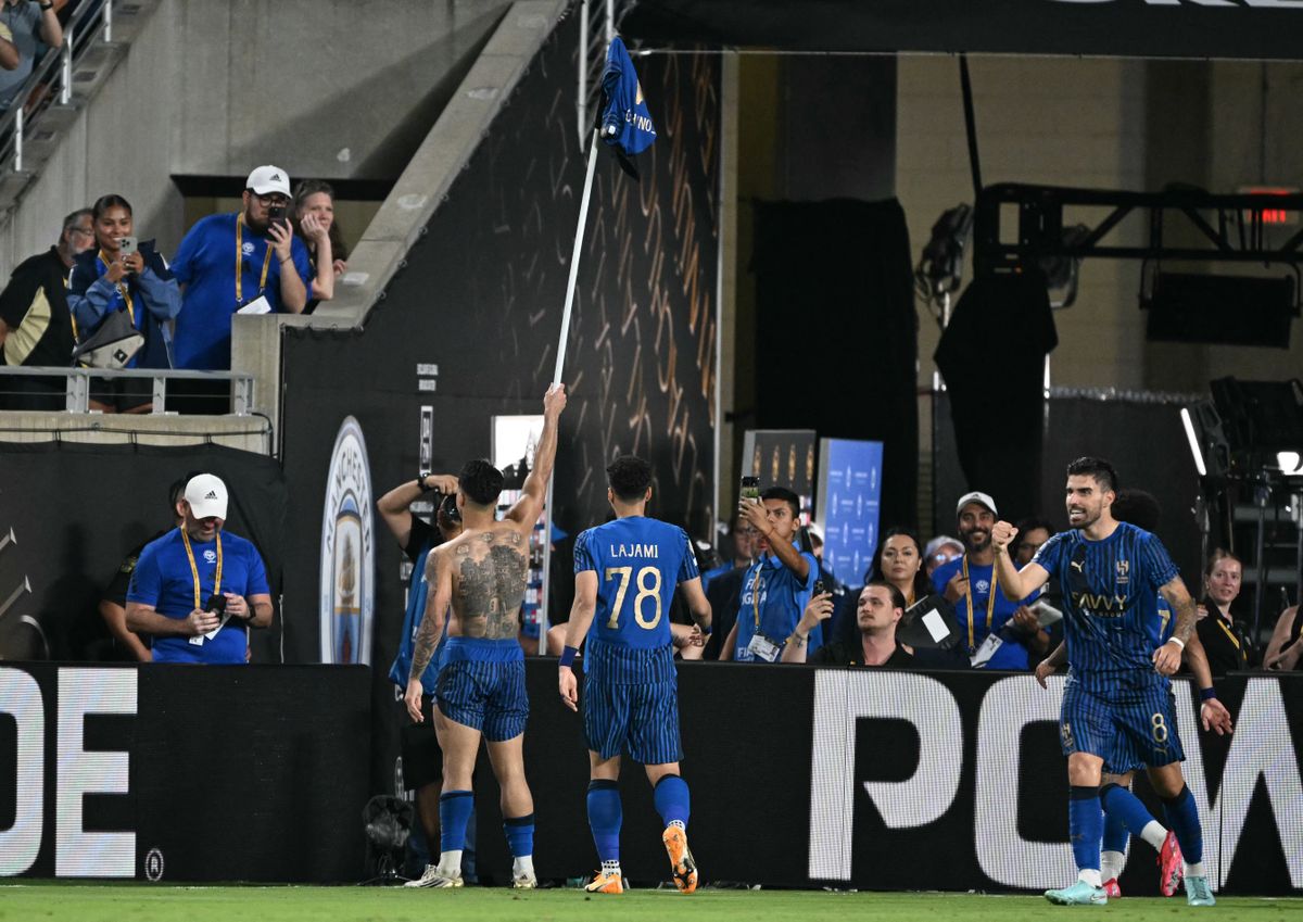 Al Hilal's Brazilian forward #11 Marcos Leonardo (L) celebrates with teammate Saudi defender #78 Ali Lajami after scoring his team's fourth goal during the FIFA Club World Cup 2025 round of 16 football match between England's Manchester City and Saudi's Al-Hilal at the Camping World stadium in Orlando on June 30, 2025. (Photo by PATRICIA DE MELO MOREIRA / AFP)