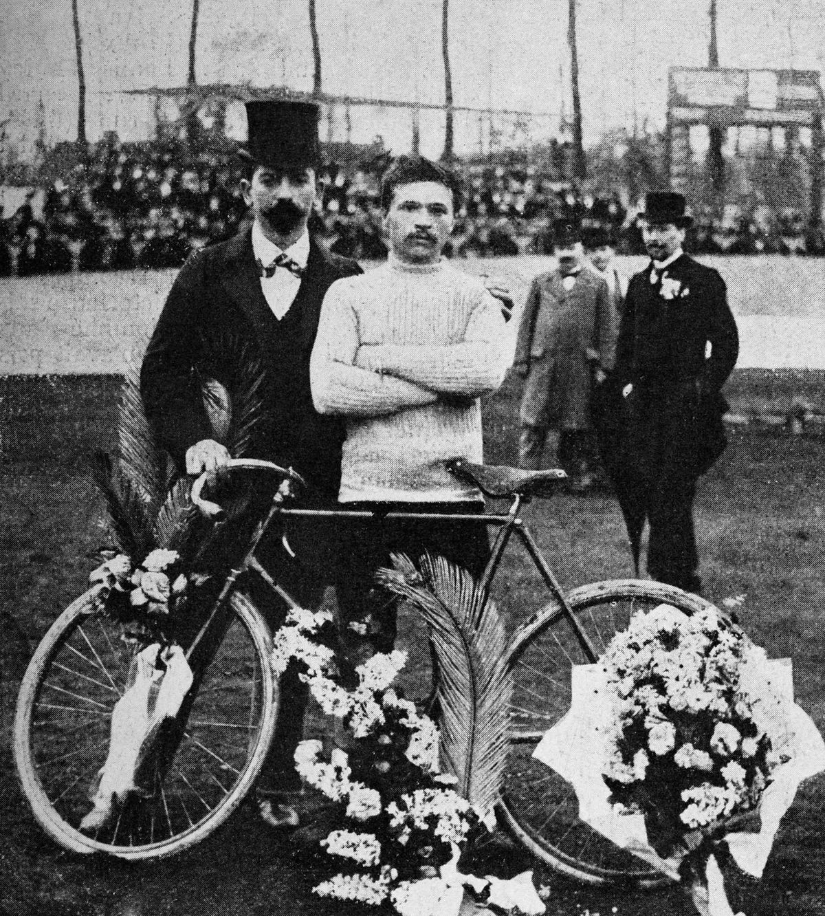 Maurice Garin (centre), winner of the one-day professional bicycle race from Paris to Roubaix, circa April 1898.  (Photo by Popperfoto/Getty Images)