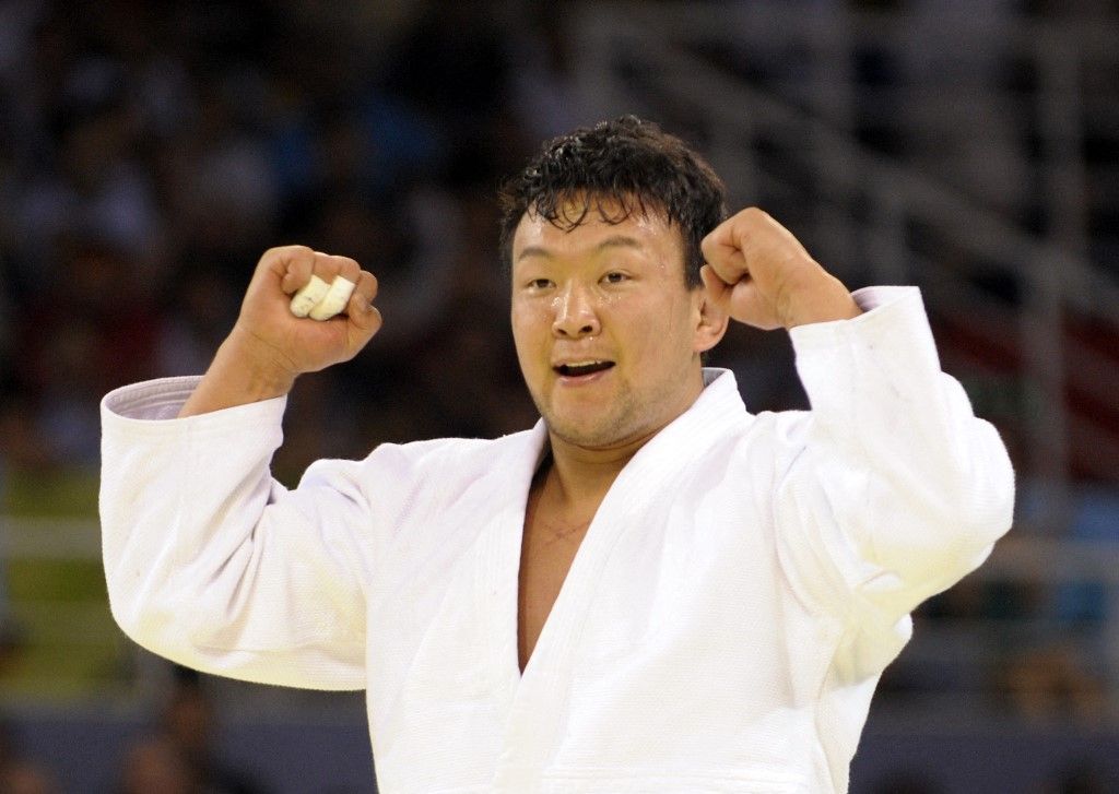 Mongolia's Tuvshinbayar Naidan celebrates after defeating Kazakhstan's Askhat Zhitkeyev in the men's -100 kgs judo match of the 2008 Beijing Olympic Games on August 14, 2008 in Beijing. Tuvshinbayar Naidan won the gold. AFP PHOTO / TOSHIFUMI KITAMURA (Photo by TOSHIFUMI KITAMURA / AFP)