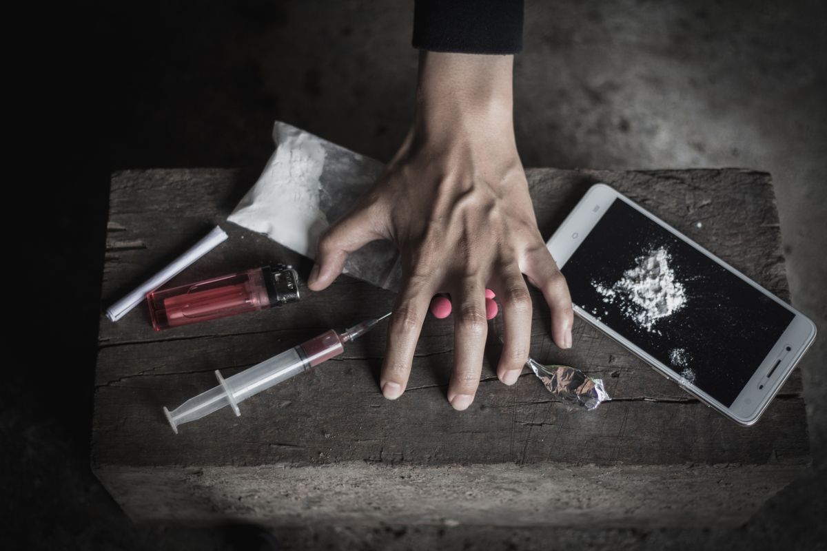 Human hands on dark background, Stop drug addiction concept, Do not interfere with drugs,  International Day against Drug Abuse.
