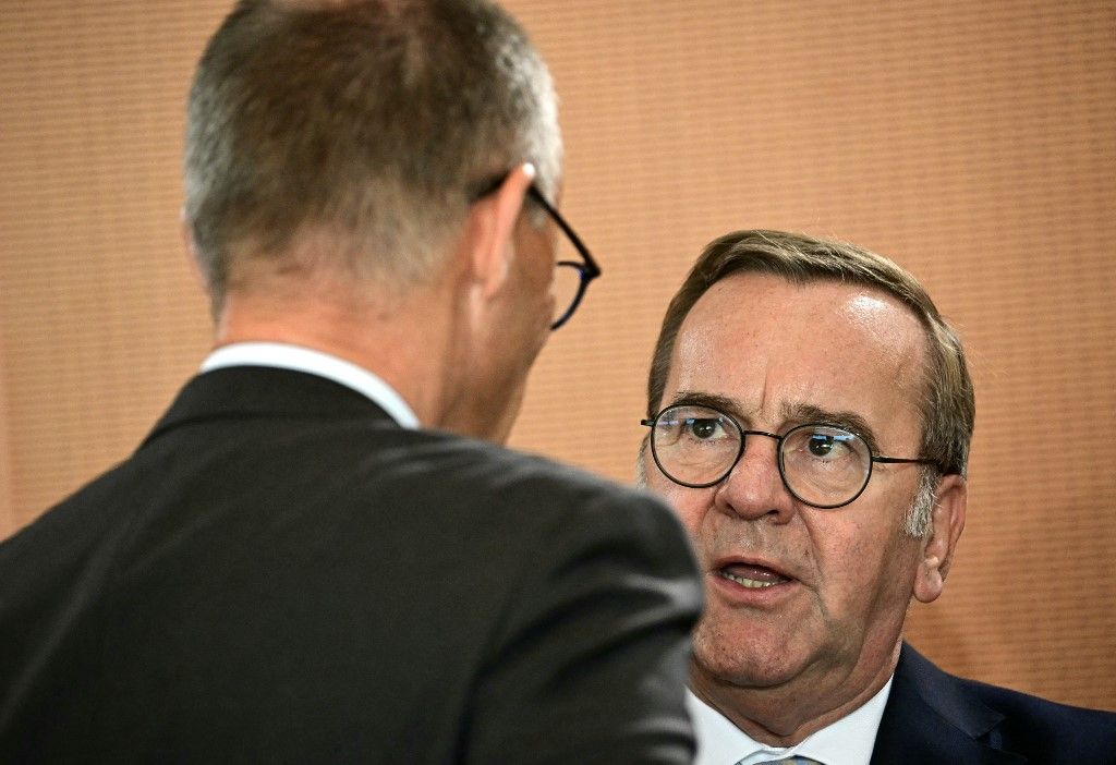 German Defence Minister Boris Pistorius (R) talks with German Chancellor Friedrich Merz before attending the weekly meeting of the German cabinet at the Chancellery in Berlin on July 2, 2025. (Photo by Tobias SCHWARZ / AFP)