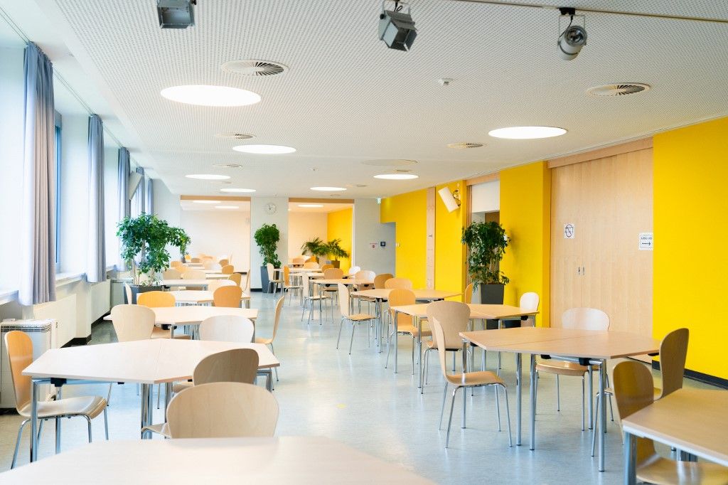 04 November 2021, Bavaria, Würzburg: View into the canteen of the Matthias-Grünewald-Gymnasium in Würzburg. At the 12th German Congress on School Catering, the "Golden Plate" prize for the best school canteen in Germany was awarded to the Matthias-Grünewald-Gymnasium in Würzburg. Photo: Nicolas Armer/dpa (Photo by Nicolas Armer / dpa Picture-Alliance via AFP)