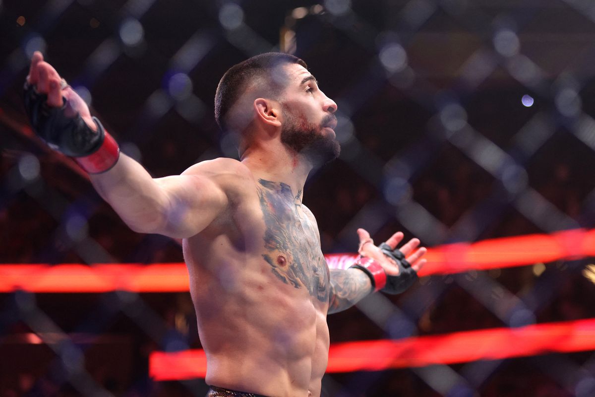 LAS VEGAS, NEVADA - JUNE 28: Ilia Topuria of Georgia reacts after knocking out Charles Oliveira of Brazil to secure the lightweight main event title with a first round knock out during UFC 317 at T-Mobile Arena on June 28, 2025 in Las Vegas, Nevada.   Ian Maule/Getty Images/AFP (Photo by Ian Maule / GETTY IMAGES NORTH AMERICA / Getty Images via AFP)