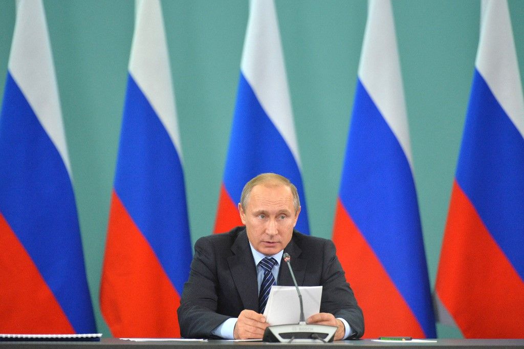 Russian President Vladimir Putin speaks during a meeting with heads of Russian sports federations in Sochi on November 11, 2015. Vladimir Putin on November 11 ordered an inquiry into allegations of "state-supported" drug abuse in athletics that have left Russia facing a possible Olympics ban, but insisted any punishment should be individual and not collective. AFP PHOTO / RIA NOVOSTI / ALEXEI DRUZHININ (Photo by ALEXEI DRUZHININ / RIA NOVOSTI / AFP)