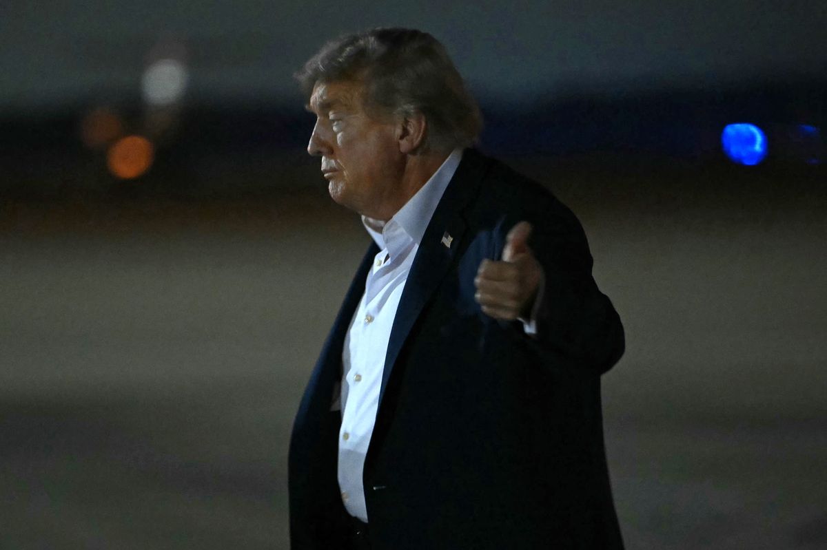 US President Donald Trump gives a thumbs up after landing at Joint Base Andrews in Maryland, on August 15, 2025. Donald Trump and Vladimir Putin made no breakthrough on Ukraine at their high-stakes summit on August 15, 2025, pointing to areas of agreement and rekindling a friendship but offering no news on a ceasefire. After an abrupt ending to three hours of talks with aides, Trump and Putin offered warm words but took no questions from reporters -- highly unusual for the media-savvy US president. (Photo by ANDREW CABALLERO-REYNOLDS / AFP)
