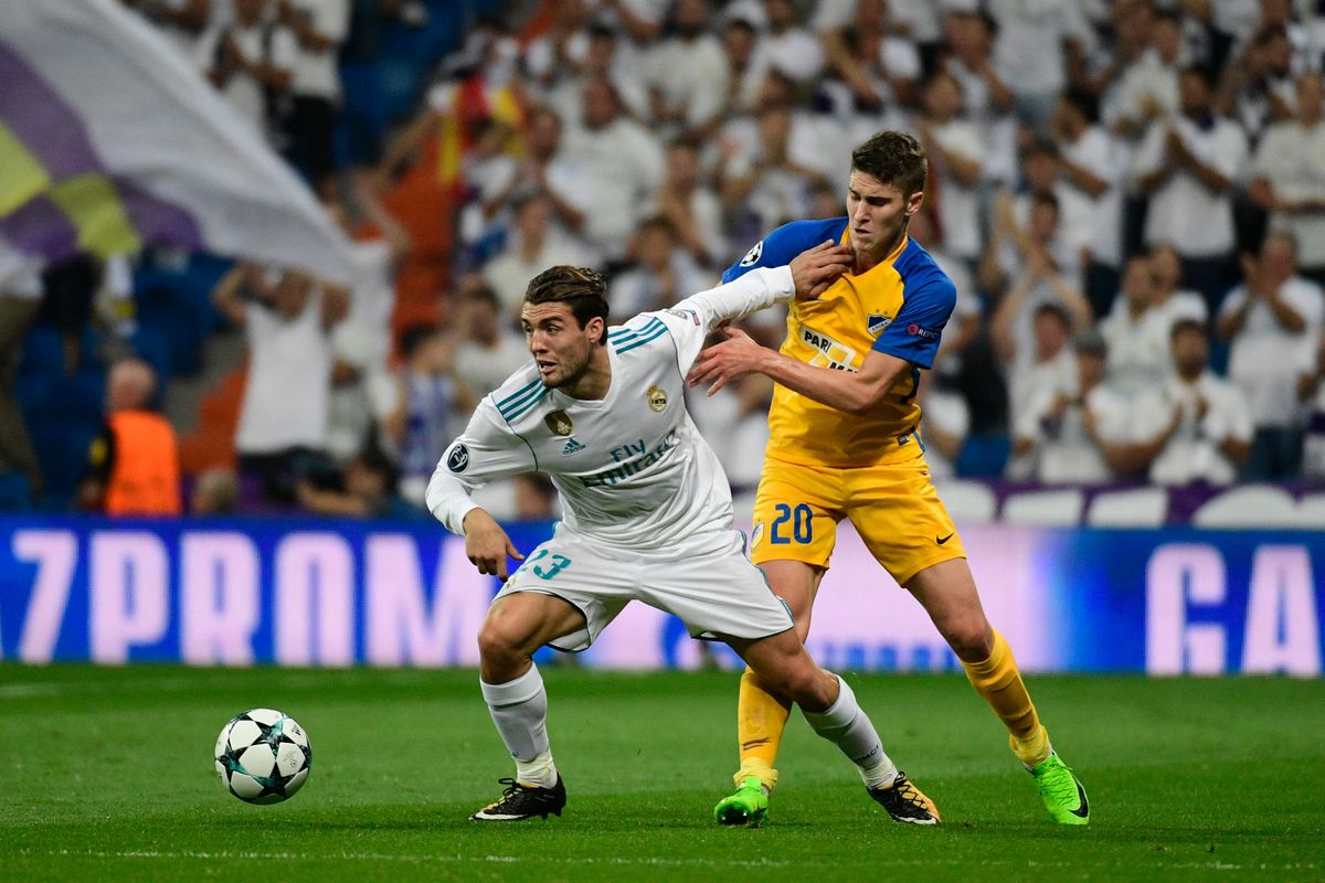 Real Madrid's midfielder from Croatia Mateo Kovacic (L) vies with APOEL Nicosia's midfielder from Hungary Roland Sallai during the UEFA Champions League football match Real Madrid CF vs APOEL FC at the Santiago Bernabeu stadium in Madrid on September 13, 2017. (Photo by PIERRE-PHILIPPE MARCOU / AFP)