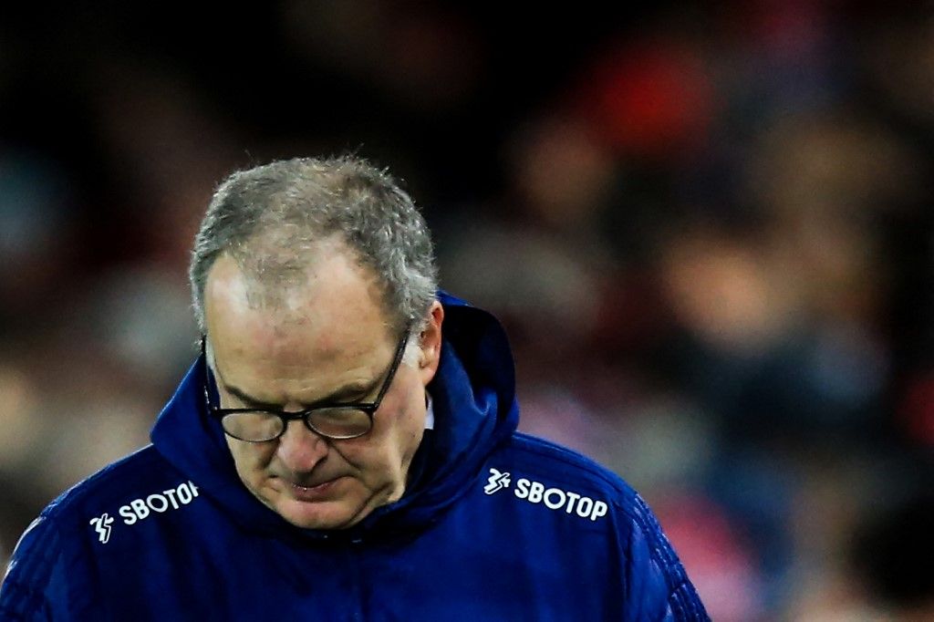 Leeds United's Argentinian head coach Marcelo Bielsa reacts at the end of the English Premier League football match between Liverpool and Leeds at the Anfield stadium, in Liverpool, north west England on February 23, 2022. (Photo by Lindsey Parnaby / AFP) / RESTRICTED TO EDITORIAL USE. No use with unauthorized audio, video, data, fixture lists, club/league logos or 'live' services. Online in-match use limited to 120 images. An additional 40 images may be used in extra time. No video emulation. Social media in-match use limited to 120 images. An additional 40 images may be used in extra time. No use in betting publications, games or single club/league/player publications. / 