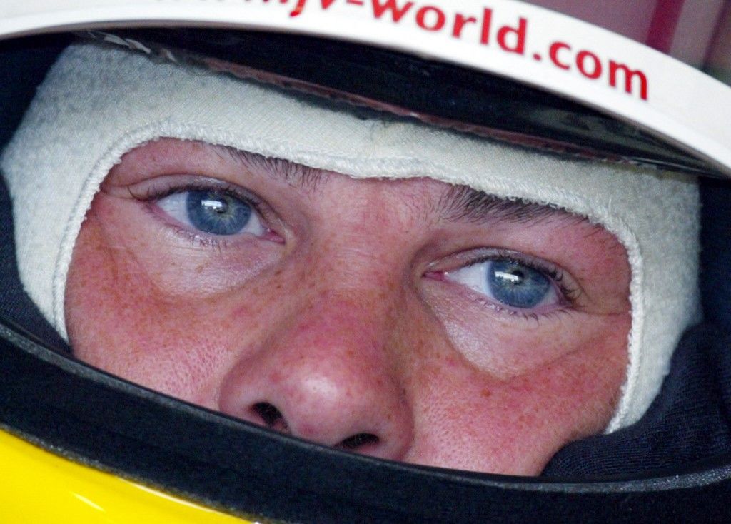 Canadian BAR-Honda driver Jacques Villeneuve sits in his car in the pits of the Hungaroring racetrack near Budapest, during the first free practice session, 16 August 2002, two days before the Hungarian Formula One Grand Prix. AFP PHOTO PATRICK HERTZOG (Photo by PATRICK HERTZOG / AFP)