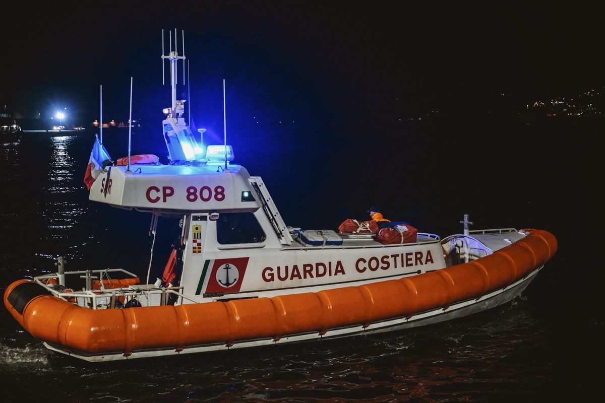 VIBO VALENTIA, ITALY - MARCH 10: A patrol boat of the Italian Coast Guard is seen before docking operations in Vibo Valentia, Italy on March 10, 2025. The German rescue vessel Sea-Eye 4 arrived in the port of Vibo Valentia for disembarking 122 migrants rescued in four different operations across the Mediterranean Sea in a joint operation with Sea Watch and Mediterranean Saving Humans. Valeria Ferraro / Anadolu (Photo by Valeria Ferraro / Anadolu via AFP)