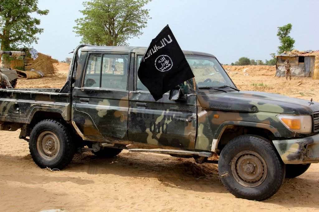 A vehicle allegedly belonging to the Islamic State group in West Africa (ISWAP) is seen in Baga on August 2, 2019. Intense fighting between a regional force and the Islamic State group in West Africa (ISWAP) has resulted in dozens of deaths, including at least 25 soldiers and more than 40 jihadists, in northeastern Nigeria. ISWAP broke away from Boko Haram in 2016 in part due to its rejection of indiscriminate attacks on civilians. Last year the group witnessed a reported takeover by more hardline fighters who sidelined its leader and executed his deputy. The IS-affiliate has since July 2018 ratcheted up a campaign of attacks against military targets. (Photo by AUDU MARTE / AFP)