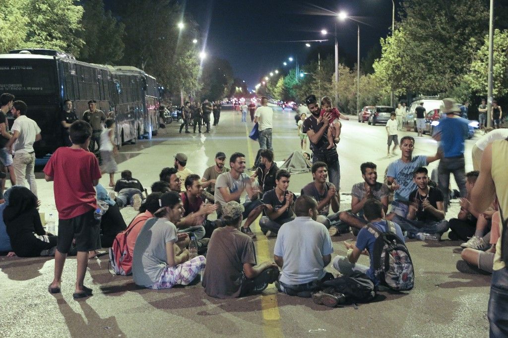 Migrants and refugees from camps around the city gather outside of the consulate of Germany in Thessaloniki on September 1, 2016 to protest against the difficult living conditions in the camps and to ask for the openning of the borders (Photo by Nicolas Economou/NurPhoto) (Photo by Nicolas Economou / NurPhoto via AFP)