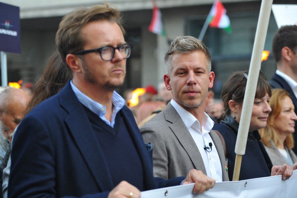 Michal Wawrykiewicz, Polish MEP (left), and Peter Magyar, Hungarian MEP (right), attend a memorial held by the Tisza Party on the anniversary of the 1956 Hungarian Revolution. (Photo by Balint Szentgallay/NurPhoto) (Photo by Balint Szentgallay / NurPhoto via AFP)