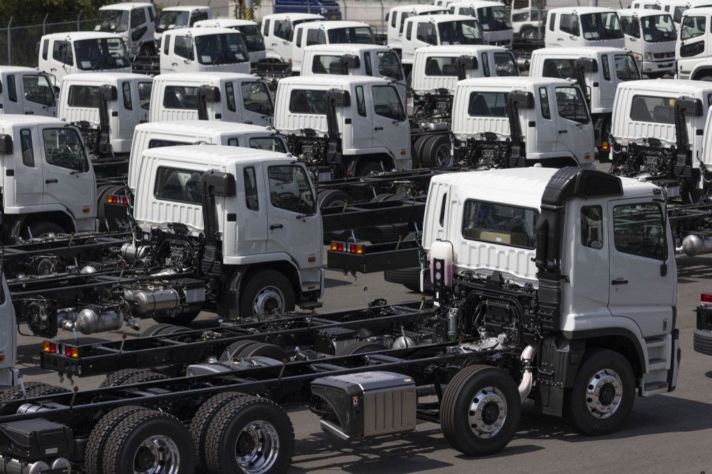 Mitsubishi trucks parked on Daikokufuto island inside Tokyo Bay. Yokohama, August 28, 2025. - 20250828_PD26977 (Photo by Stanislav Kogiku / APA-PictureDesk via AFP)
