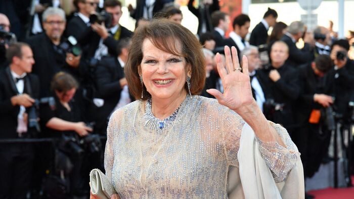 French actress Claudia Cardinale waves as she arrives on May 23, 2017 for the '70th Anniversary' ceremony of the Cannes Film Festival in Cannes, southern France. (Photo by Alberto PIZZOLI / AFP)