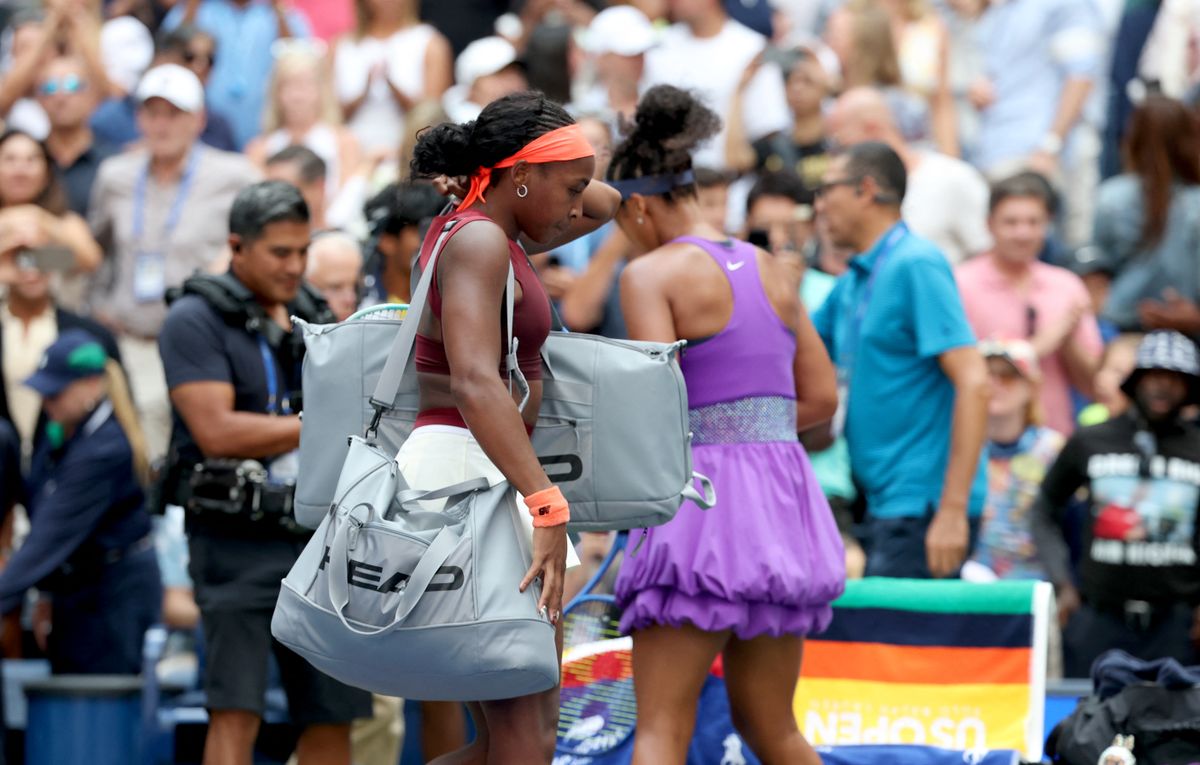 USA's Coco Gauff (L) leaves the court after losing against Japan's Naomi Osaka during their women's singles round of 16 tennis match on day nine of the US Open tennis tournament at the USTA Billie Jean King National Tennis Center in New York City, on September 1, 2025. (Photo by TIMOTHY A.CLARY / AFP)